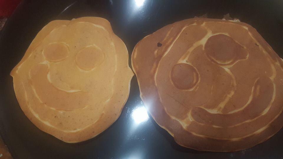 happy face pancakes that look a little scary